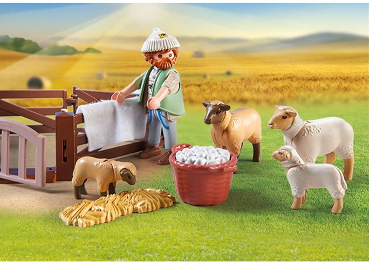 Pastýř ze stavebnice Mladý pastýř s ovečkami pozoruje ovečky pobíhající okolo ohrady