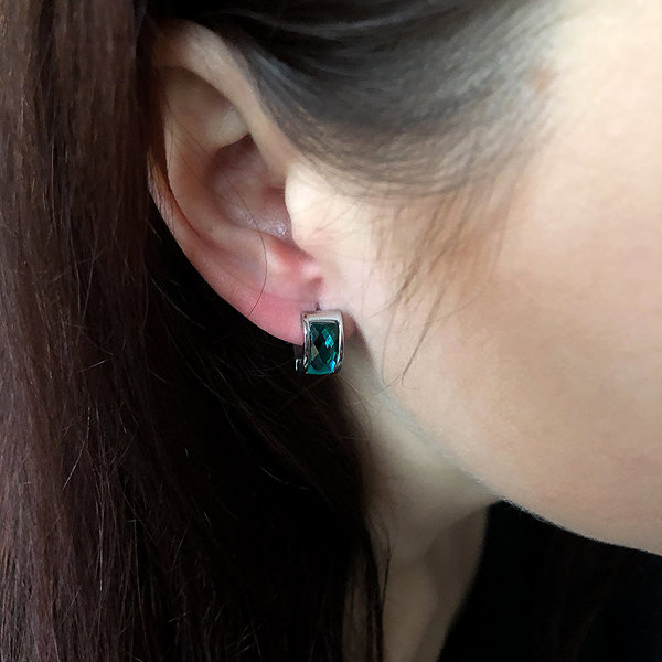 Bruno Hoop earrings with a turquoise stone.