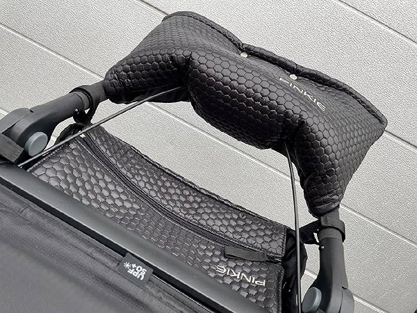 Pinkie Black Comb organiser on a Thule pushchair.