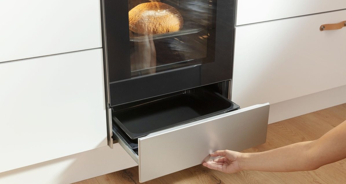 Practical cooker storage compartment